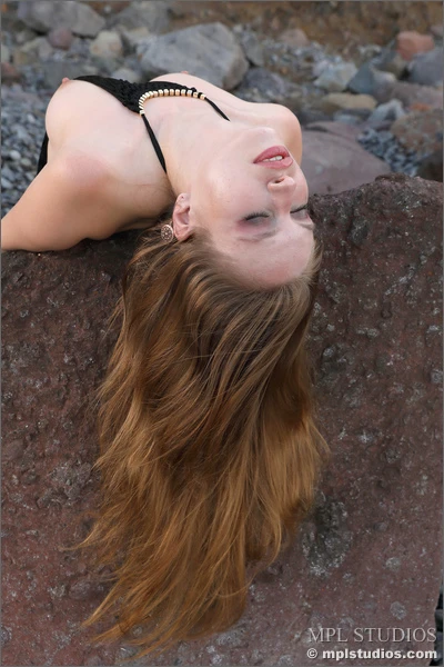 Aristeia lays back on rocks